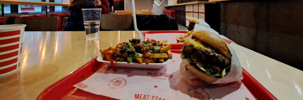 food served in meat stack, in leeds - showing a burger and loaded fries