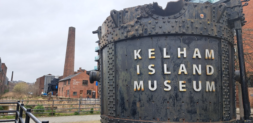 exterior of kelham island museum, sheffield. image includes a chimney and the river don