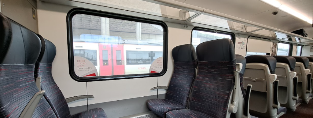 Seats on a Stansted Express train. Image shows a bay of 4 without a table