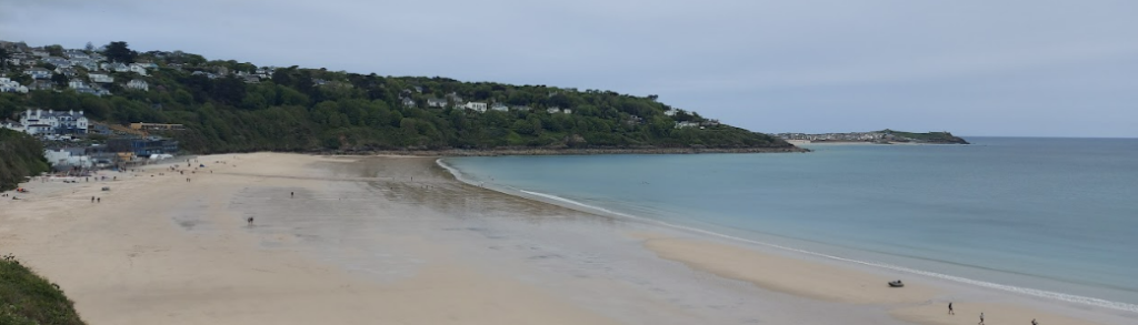 carbis bay beach, which you can visit by train