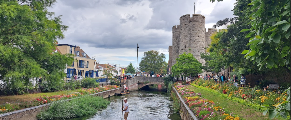 the centre of canterbury, kent, which shows the westgate tower and gardens